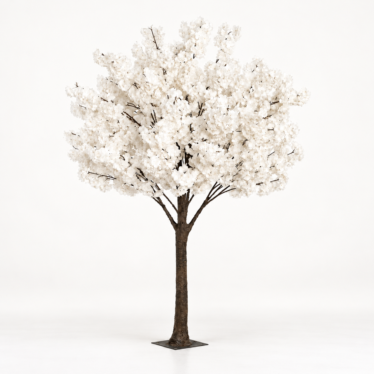 White cherry blossom tree with a branching trunk and square base